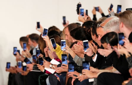 Mobile phones out in force during British designer John Galliano Spring/Summer 2018 show.