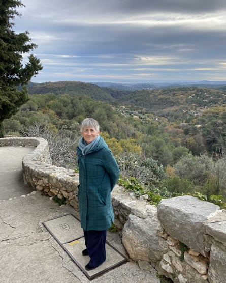 Helen standing on a parth looking over a green landscape