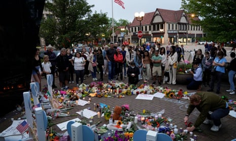 Mourners visit a memorial site after a mass shooting at a Fourth of July parade in the Chicago suburb of Highland Park, Illinois, on Wednesday.