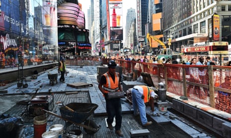 Workers repair the road in Times Square, New York City