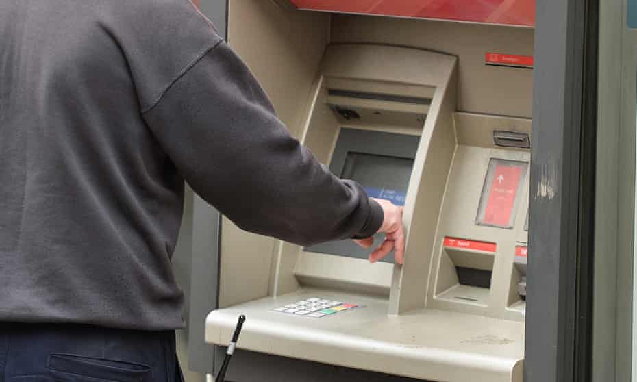 A person using a cash machine