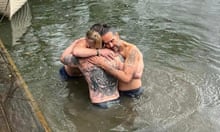 Russell Brand being baptised in the River Thames with Bear Grylls