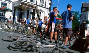 Mountain bikers relaxing in Llanwrtyd Wells outside the Neuadd Arms.