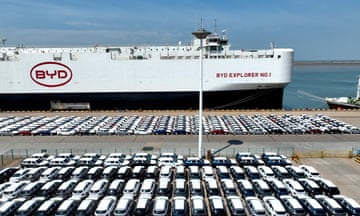 A drone view shows BYD electric vehicles parked up before being loaded on to a BYD ship for export