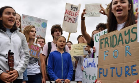 Greta Thunberg, center, and youth activists protest outside the White House on 13 September.