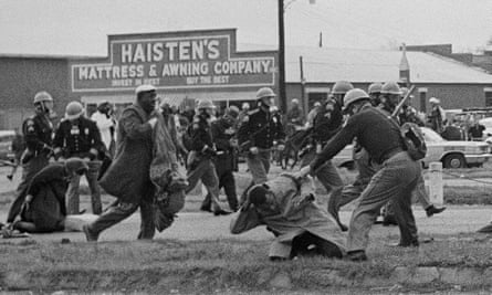 State troopers beat civil rights protesters in Selma, Alabama on 7 March 1965.