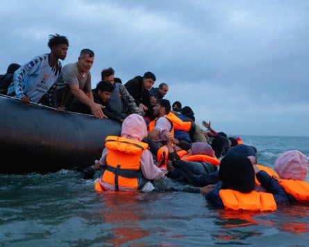 people crowd onto a dinghy
