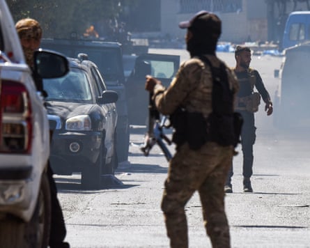 Syrian security forces deploy during clashes in Sweida city on Wednesday