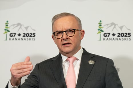 A man in a dark suit.