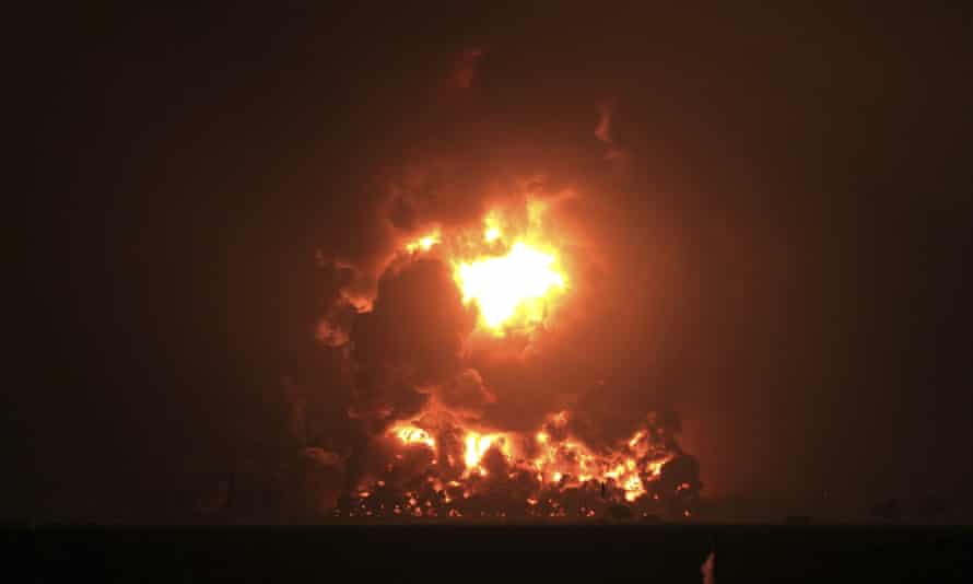 The night sky glows from the fire