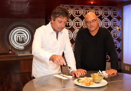 The two men on the MasterChef set with food in front of them ready to taste.