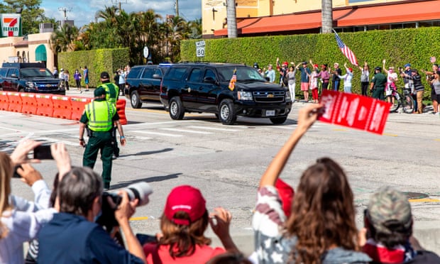 Supporters of Donald Trump wave as his motorcade drives past on the way to Mar-a-Lago in Florida on Wednesday.
