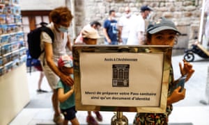 Coronavirus live news: Tokyo has 1,359 new cases on first day of Olympics; Malaysia reports record daily cases 4 A health pass sign at a souvenir shop in Mont-Saint-Michel in Normandy yesterday.