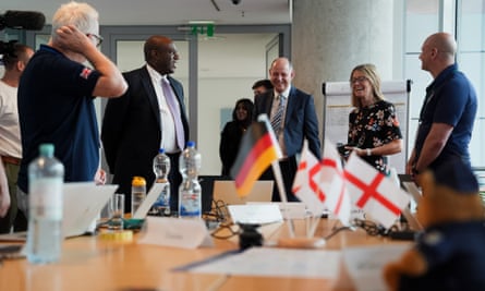 David Lammy being welcomed by several people