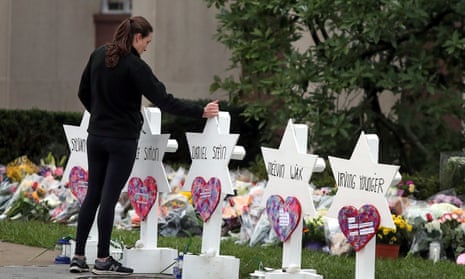 A woman stands at a memorial outside the Tree of Life synagogue in Pittsburgh, Pennsylvania