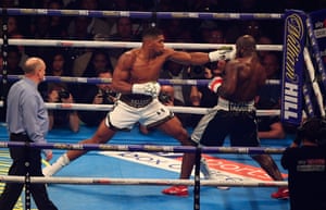 Anthony Joshua lands a left on Carlos Takam.