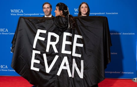 Journalist Vivian Salama displays a cape naming her colleague, Evan Gershkovich, at the annual White House Correspondents' Association Dinner in Washington.