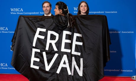 Journalist Vivian Salama displays a cape with the name of her colleague, Evan Gershkovich.