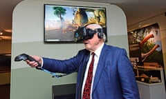 Sir David Attenborough feeds a sauropod in the virtual reality exhibit at the Yorkshire’s Jurassic World exhibition in York