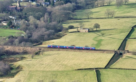 Train in landscape near Edale, Peak District, Derbyshire, UK.