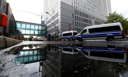 Police vehicles parked outside the Charité hospital complex in Berlin.