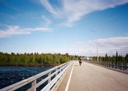 Cycling across the Muonio River in Finland