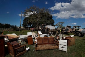 The flood-affected belongings of Em Trotter and her family on the lawn for pickup in Croki.