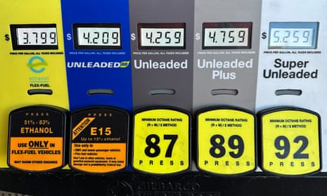 a row of gasoline options with buttons and small screens showing prices