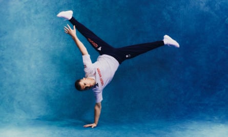 Gymnast Max Whitlock performs a one-handed handstand in new Team GB kit