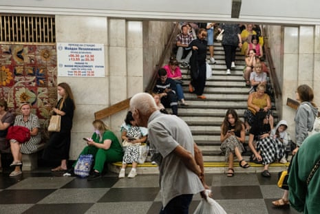 People take shelter in a Kyiv metro station from shelling after Russian combined strike on Ukraine