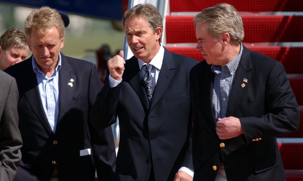 Christopher Meyer, left, and the US chief of protocol Donald Ensenat, right, greeting the UK prime minister Tony Blair on his arrival in the US in 2002 for a meeting with President George W Bush at Camp David.