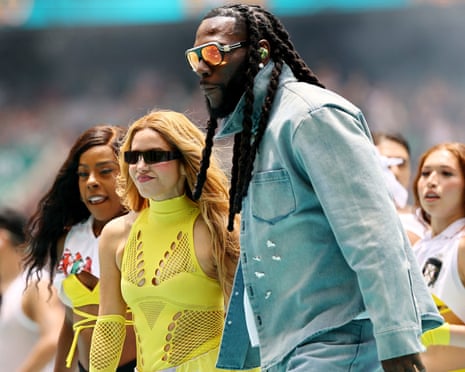 Shakira and Burna Boy perform during the opening ceremony