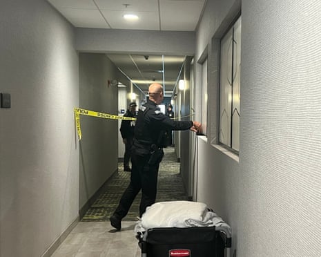 Police tape off hotel rooms where the person of interest was arrested.