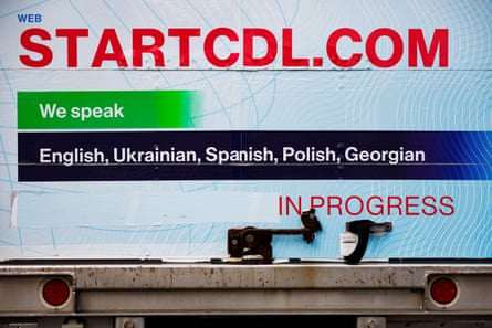 the backmost of a motortruck sounds ‘StartCDL.com we speak English Ukrainian Spanish Polish Georgian’