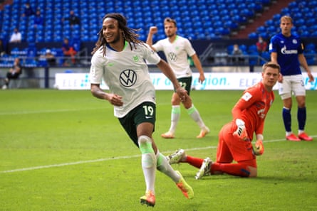 Wolfsburg’s Kevin Mbabu celebrates after scoring against Schalke 04.