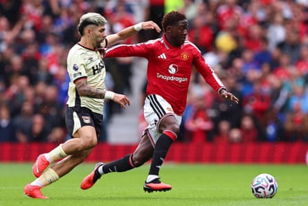 Julio Enciso of Ipswich Town battles with Kobbie Mainoo of Manchester United.