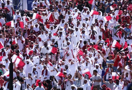 Qatar fans celebrate after the team's first goal by Hassan Al Haydos.