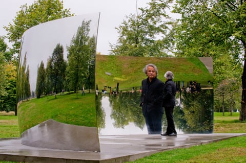  Artist Anish Kapoor is reflected in C-Curve 2007, part of the Turning the World Upside Down, four reflective stainless steel sculptures in Kensington Gardens, west London. 