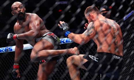 Jon Jones knocks out Stipe Miocic to retain UFC title as Trump looks on | UFC | The Guardian