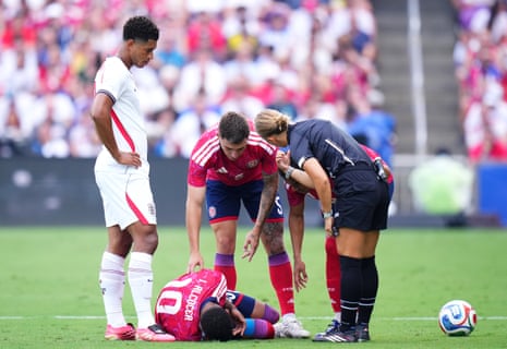 Josimar Alcocer of Costa Rica goes after clashing with James.