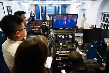 Reporters watch as Donald Trump addresses the nation regarding the US bombing of Iranian nuclear sites.