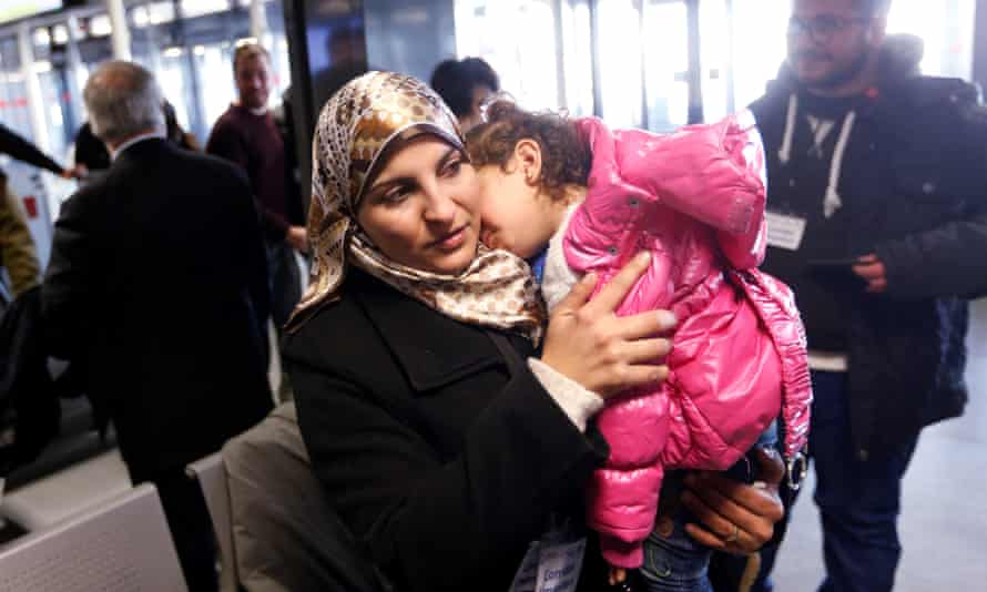 A Syrian refugee with her child.