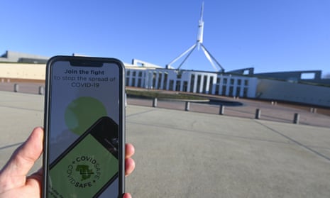 An iPhone displays the Covidsafe coronavirus contact-tracing app in front of Parliament House in Canberra. Labor wants the app’s contract with Amzon to be cancelled and handed to an Australian cloud provider instead, which would move the data further from US law enforcement grasp.