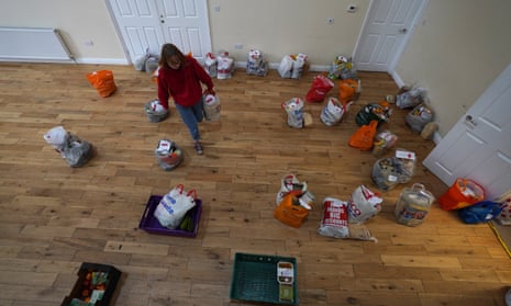A volunteer prepares food parcels to be delivered in London, England. 