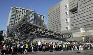 Students stand outside the office of House Speaker Nancy Pelosi during a protest against climate change Friday, in San Francisco. Friday’s rallies were one of the biggest international climate change actions yet, involving hundreds of thousands of students in more than 100 countries around the globe.