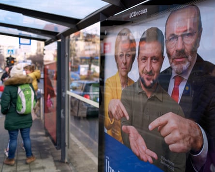 Poster shows Zelenskyy holding out his hand, with the two others pointing
