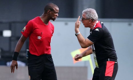 The Tunisia coach Mondher Kebaier (right) remonstrates with referee Janny Sikazwe, who twice blew the final whistle early in Mali’s victory.