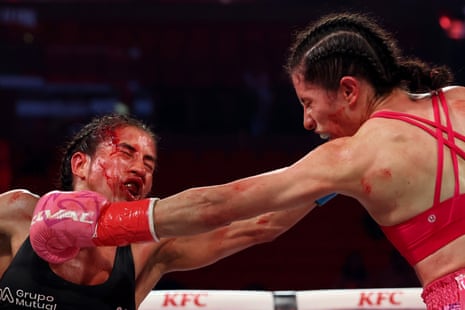 Yokasta Valle, left, and Yadira Bustillos trade blows during their strawweight title fight.