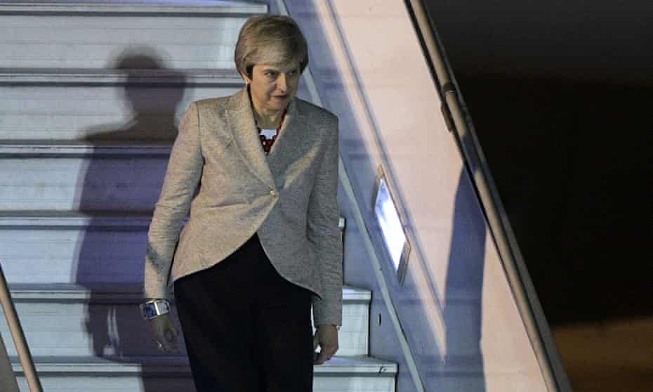 Theresa May steps off her plane upon arrival at Ezeiza International airport in Buenos Aires
