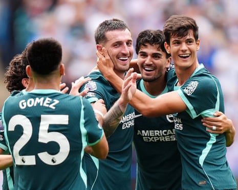 Lewis Dunk celebrates with his Brighton teammates.